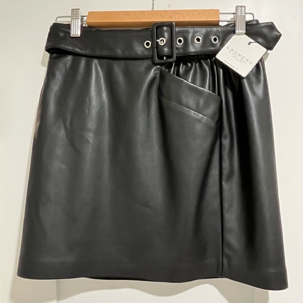Black pleather skirt with belt. Brand New w/tags. Never worn.